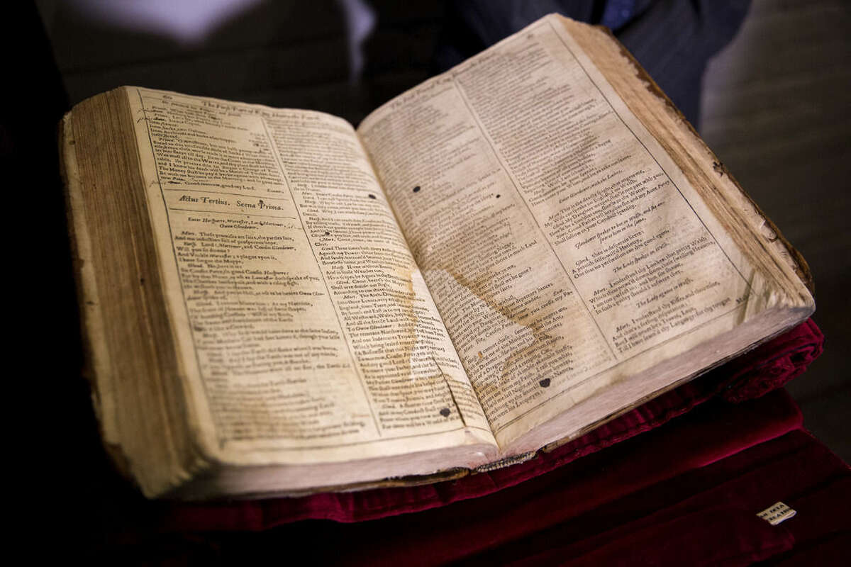 The First Folio of Shakespeare plays recently discovered in Saint-Omer in France, is displayed after a press conference at Shakespeare's Globe theatre in London, Monday, Feb. 23, 2015. The edition, which will be exhibited at the Globe in 2016 the year of the 400th anniversary of Shakespeares' death, is one of 230 copies of the 1623 Shakespeare First Folio and is notable for its scribbled stage directions. (AP Photo/Matt Dunham)