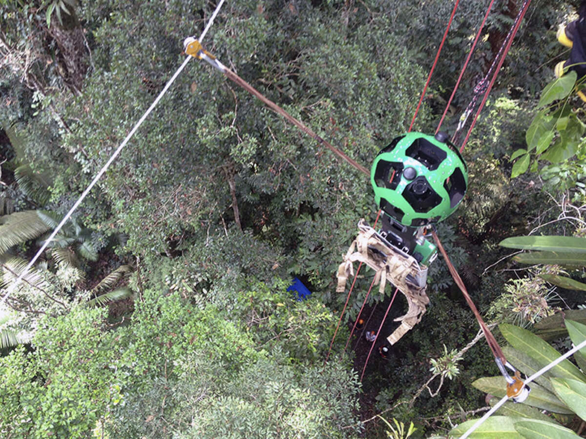 This undated image released by Google on Monday, March 2, 2015 shows the company's Trekker device on a zipline above the Amazon jungle in South America. The images taken by the Trekker are the latest addition to the diverse collection of photos supplementing Google’s widely used digital maps. (AP Photo/Google)