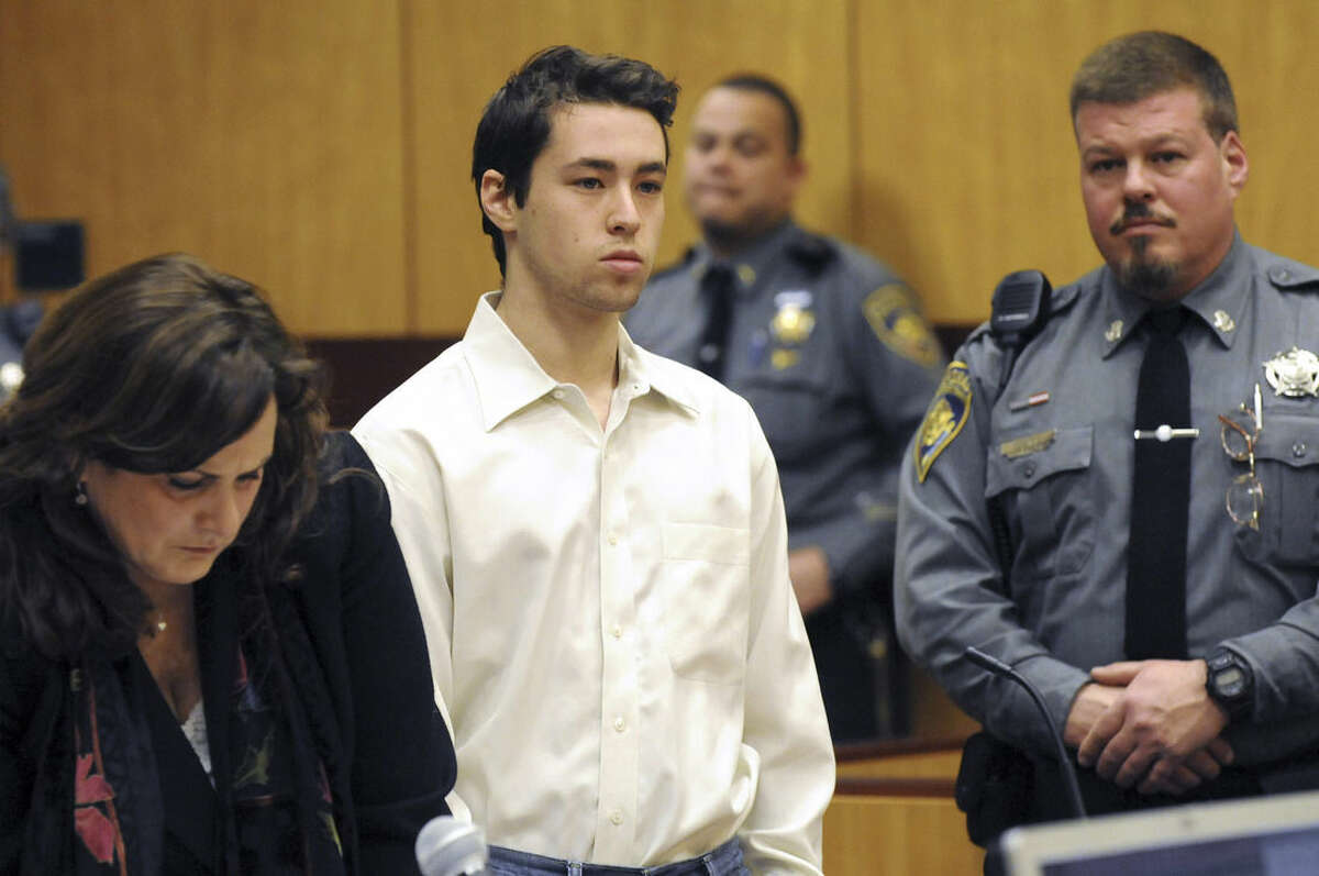 FILE - In this Feb. 25, 2015 file photo, Wesleyan University sophomore and neuroscience major Zachary Kramer, 21, stands during his arraignment at Middletown, Conn., Superior Court for possession of controlled substances and other charges. He is one of four students arrested after a rash of illnesses on campus linked to the party drug Molly. (AP Photo/The Hartford Courant, Patrick Raycraft, Pool)