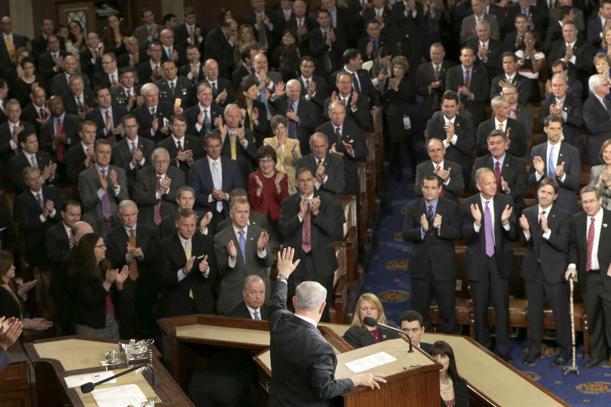 Israeli Prime Minister Benjamin Netanyahu waves after speaking before a joint meeting of Congress on Capitol Hill in Washington, Tuesday, March 3, 2015. In a speech that stirred political intrigue in two countries, Netanyahu told Congress that negotiations underway between Iran and the U.S. would "all but guarantee" that Tehran will get nuclear weapons, a step that the world must avoid at all costs. (AP Photo/J. Scott Applewhite)