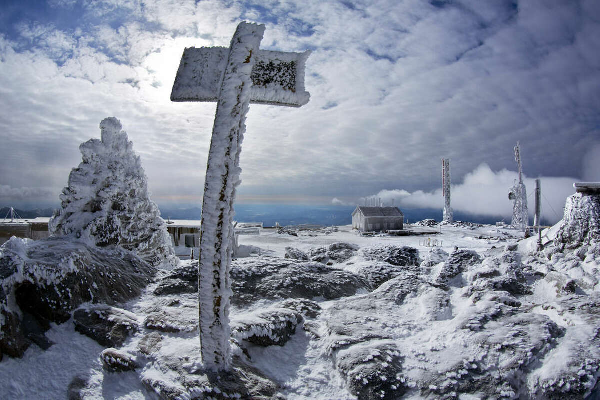 In this Tuesday, March 10, 2015 photo, a sign marks the summit of 6,288-foot Mount Washington, New Hampshire. (AP Photo/Robert F. Bukaty)