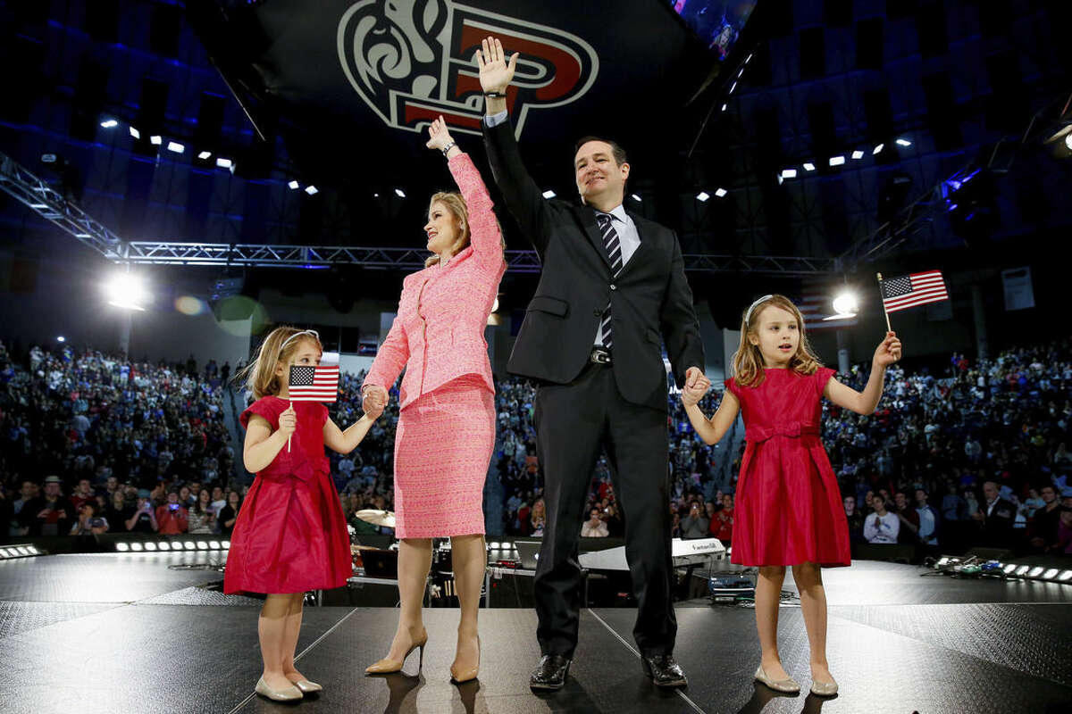 Sen. Ted Cruz, R-Texas, his wife Heidi, and their two daughters Catherine, 4, left, and Caroline, 6, right, wave on stage after he announced his campaign for president, Monday, March 23, 2015 at Liberty University, in Lynchburg, Va. Cruz, who announced his candidacy on twitter in the early morning hours, is the first major candidate to officially enter 2016 race for president. (AP Photo/Andrew Harnik)