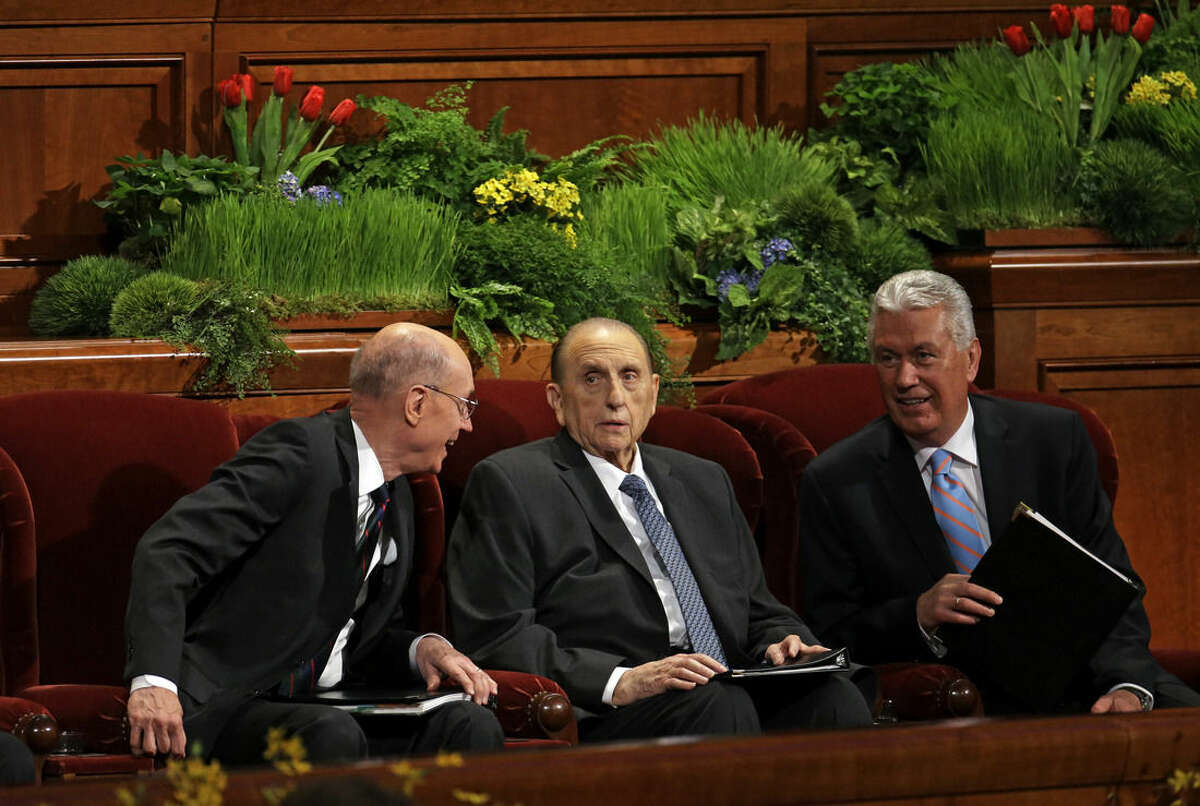 President Thomas S. Monson of The Church of Jesus Christ of Latter-day Saints, center, is flanked by President Henry B. Eyring, First Counselor in the First Presidency, left, and Dieter F. Uchtdorf, Second Counselor in the First Presidency during opening session of the two-day Mormon church conference Saturday, April 4, 2015, in Salt Lake City. More than 100,000 Mormons descended on Salt Lake City for the faith’s biannual conference to listen to spiritual guidance from leaders and to learn about church news. (AP Photo/Rick Bowmer)