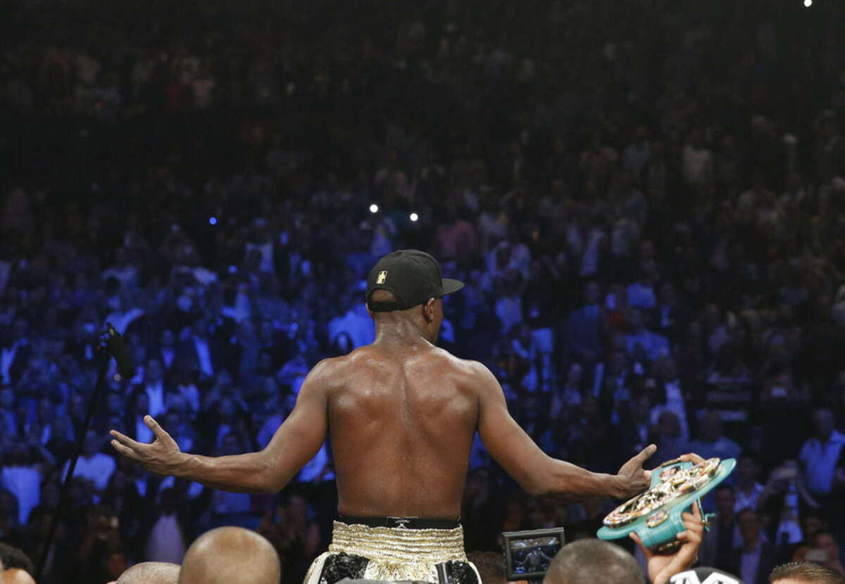 Floyd Mayweather Jr., celebrates his unanimous decision victory over Manny Pacquiao, from the Philippines, at the finish of their welterweight title fight on Saturday, May 2, 2015 in Las Vegas. (AP Photo/John Locher)