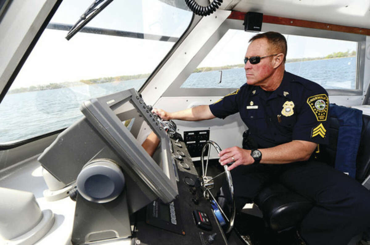 Hour photo / Erik Trautmann Seargant Peter Lapak has served in the Norwalk Police Department Marine Unit for the past 25 years.
