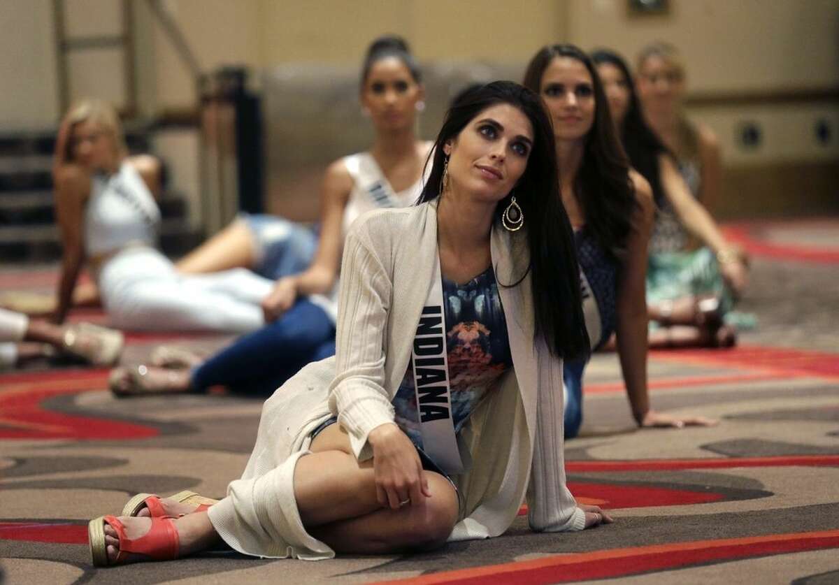 In this Monday, July 6, 2015 photo, Miss Indiana Gretchen Reece listens to instruction during rehearsal for the upcoming Miss USA Pageant, to be held this week in Baton Rouge, La. (AP Photo/Gerald Herbert)