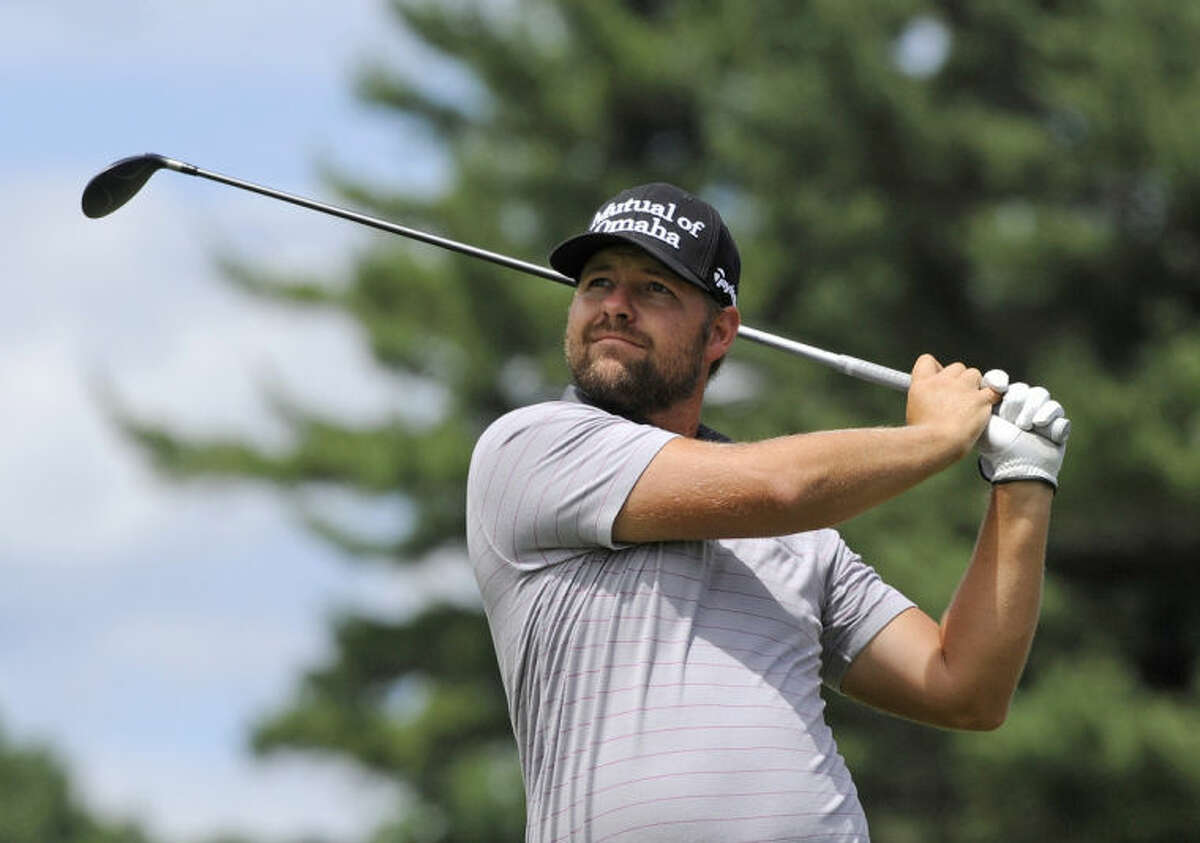 Ryan Moore watches his drive on the second hole during the third round of the Travelers Championship golf tournament in Cromwell, Conn., Saturday, June 21, 2014. (AP Photo/Fred Beckham)