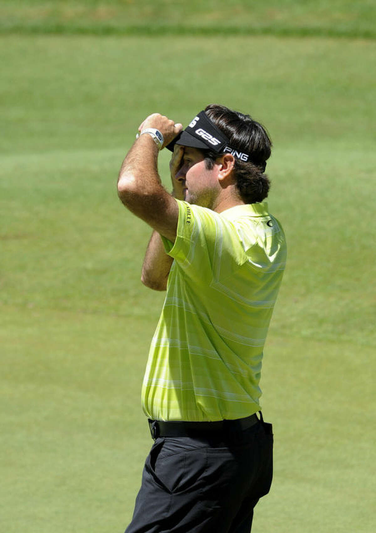 Bubba Watson reacts after finishing the third round of the Travelers Championship golf tournament in Cromwell, Conn., Saturday, June 21, 2014. (AP Photo/Fred Beckham)