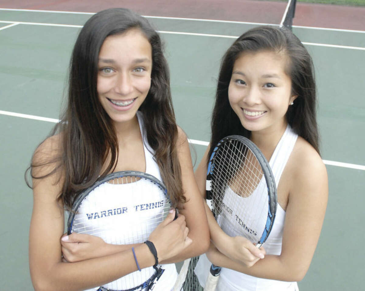 Hour photo/John Nash Wilton High's doubles tandem of Taylor Ingerman, left, and Kaitlyn Zheng helped lead Wilton to a state team championship. The two also won a State Open doubles title.
