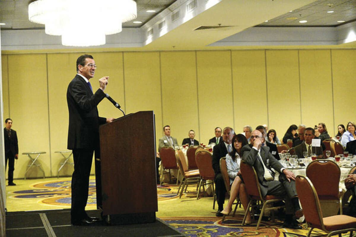 Hour photo / Erik Trautmann CT Governor Dannel Malloy addresses the Stamford Chamber of Commerce during their lucneon at the Stamford Marriot Thursday.