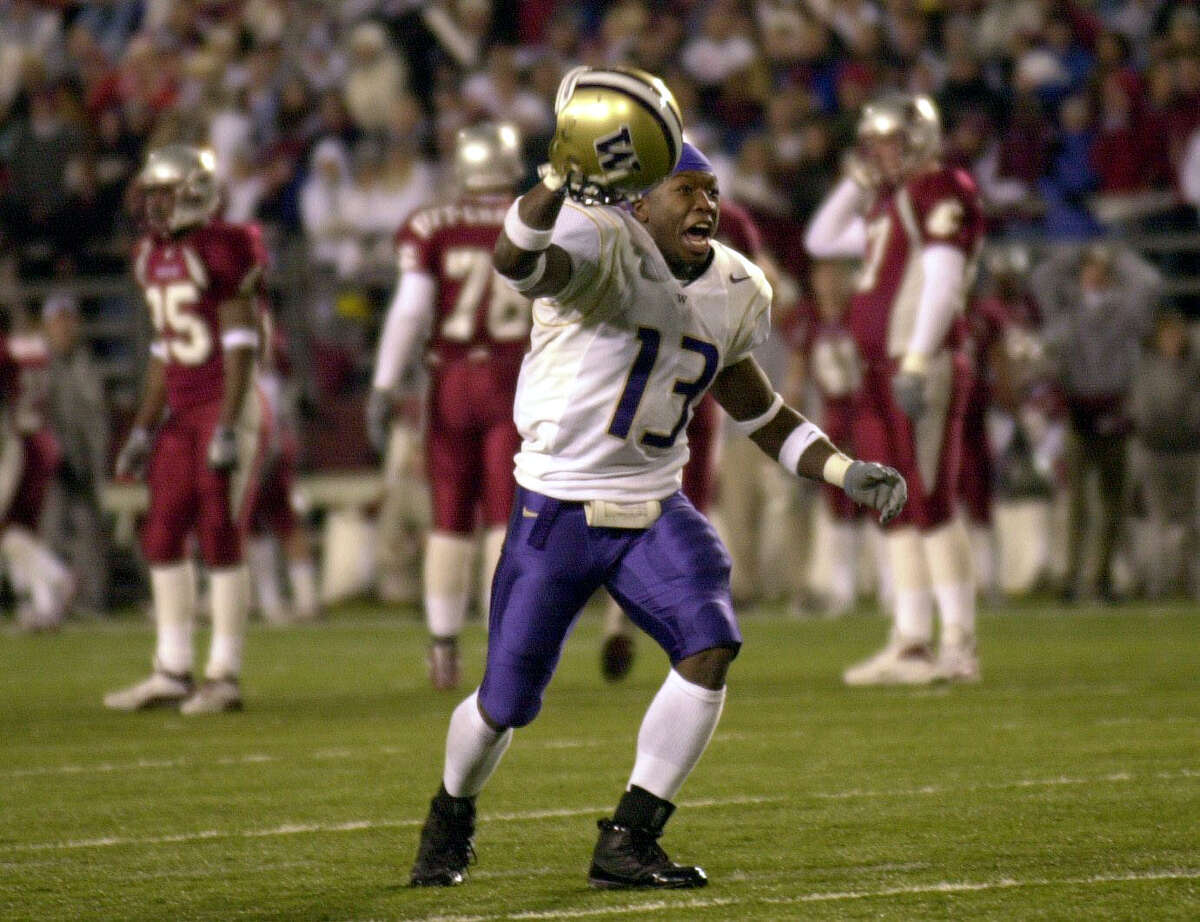 PULLMAN, WA - NOVEMBER 23: Nate Robinson #13 of the Washington Huskies celebrates after they defeated the Washington State Cougars 29-26 in triple overtime on November 23, 2002 at Martin Stadium in Pullman Washington. (Photo by Otto Greule Jr/Getty Images)