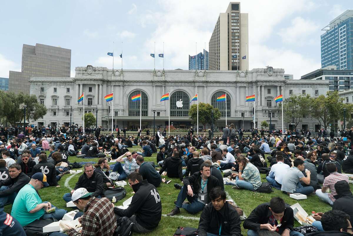 People have lunch outside City Hall during Apple World Wide Developers Conference at the Bill Graham Civic Auditorium in San Francisco, Calif. on Monday, June 13, 2016.