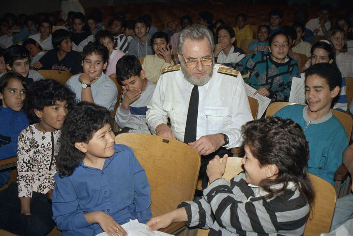 FILE - In this Monday, Nov. 30, 1987 file photo, U.S. Surgeon General C. Everett Koop sits with elementary school students at P.S. III in the Manhattan borough of New York to warn them of the dangers of smoking. In 1984, Koop called for a "smoke-free society" by the year 2000. (AP Photo/Richard Drew)