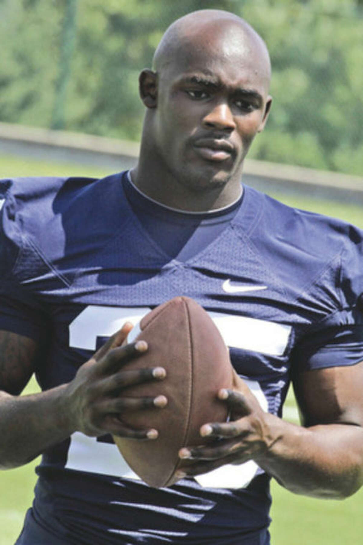 In this file photo taken Aug, 16, 2011, Penn State tailback Silas Redd takes part in the college football team's media day in State College, Pa., Tuesday, Aug. 16, 2011. Redd will be stepping in for the career school rushing leader Evan Royster this season as a sophomore. (AP Photo/Gene J. Puskar, File)