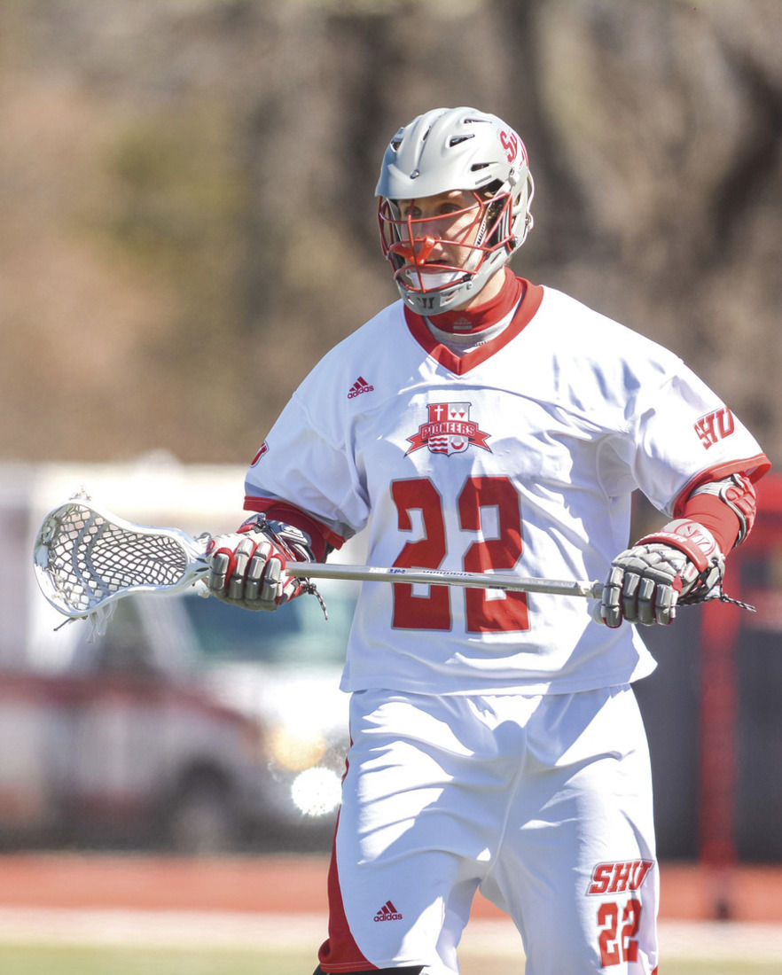 An author and a defenseman SHU lax player Slaughter writes a