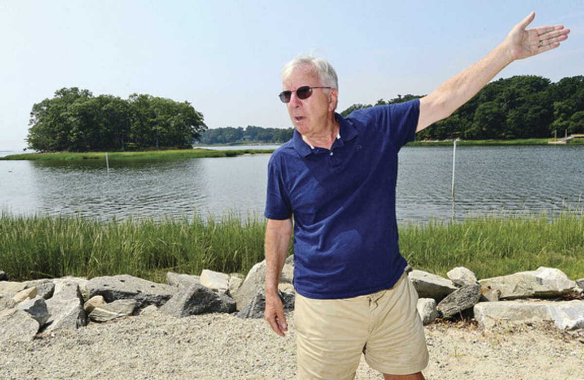 Hour photo / Erik Trautman John Moeling, President of Norwalk Land Trust, describes how Terrapin turtles use Village Creek Beach as a spawning ground and live and hunt on nearby Hoyt Island and upstream in Village Creek.