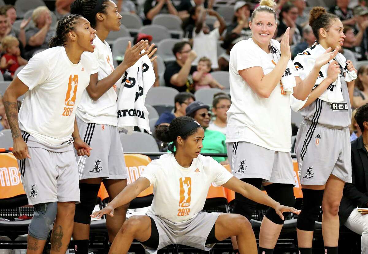 Stars’ Alex Montgomery (from left), Kayla Alexander, Sydney Colson, Jayne Appel-Marinelli, and Dearica Hamby celebrate after a basket during a first half action against the New York Liberty on June 11, 2016 at the AT&T Center.