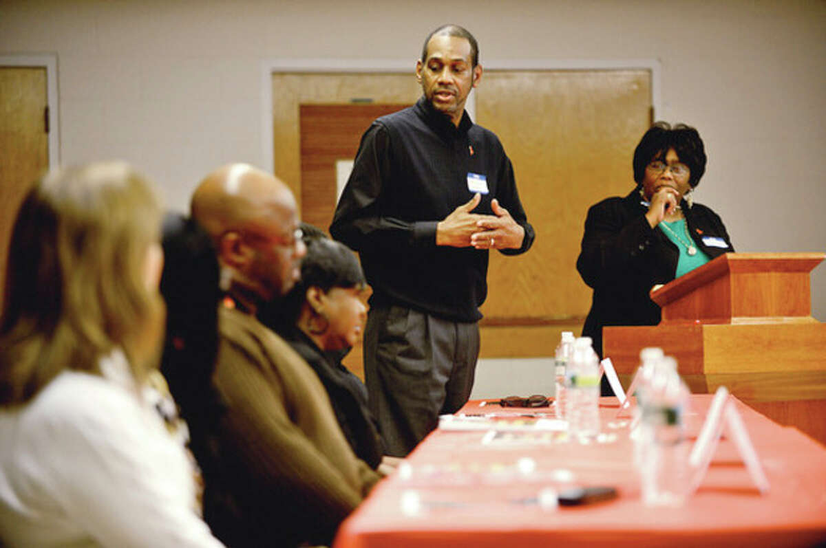 Hour photo / Erik Trautmann Deacon Michael Askew speaks as part of a panel discussion during World AIDS Day program, "I am my Brothers/Sisters Keeper" sponsored by the Norwalk Health Department HIV/AIDS Program, the Norwalk Branch of the NAACP, Fairfield County Alumni Chapter of Delta Sigma Theta Sorority Inc and Macedonia Church AIDS Ministry, Saturday at Grace Baptist Church.