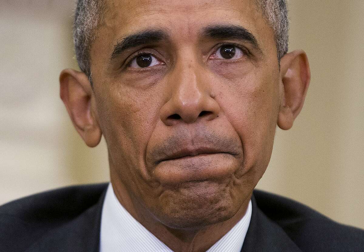 President Barack Obama pauses while speaking to members of the media in the Oval Office of the White House in Washington, Monday, June 13, 2016, after getting briefed on the investigation of a shooting at a nightclub in Orlando by FBI Director James Comey, Homeland Security Secretary Jeh Johnson, and other officials. (AP Photo/Pablo Martinez Monsivais)