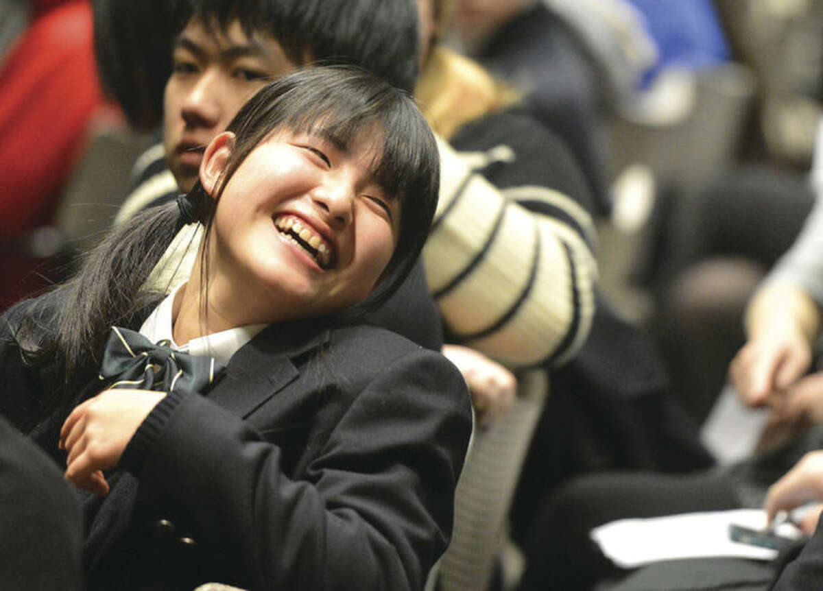 Hour Photo/Alex von Kleydorff Kojo High School student Ayano Yuki smiles as she laughs with others gathered during a program to celebrate 20 years of International Exchanges at the Center for Global Studies at Brien McMahon High School
