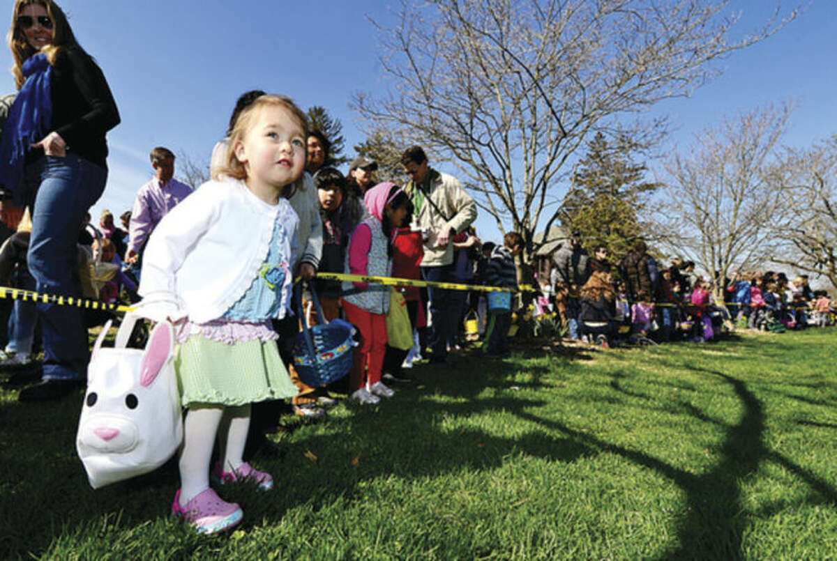 Hour photo / Erik Trautmann 2 year old Addison Pinzon gets ready to search for eggs at the Rowayton Civic Association annual Easter Egg Hunt at the Rowayton Community Center Saturday