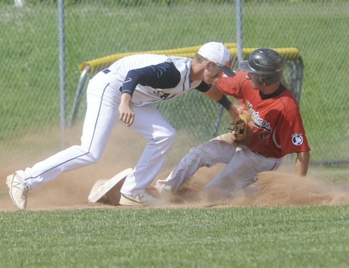 Hour photo/Matthew Vinci Staples' Benjamin Casparius puts a tag at third on Nick Nardone of Fairfield Warde Tuesday. Nardone was safe and Warde would beat Staples.