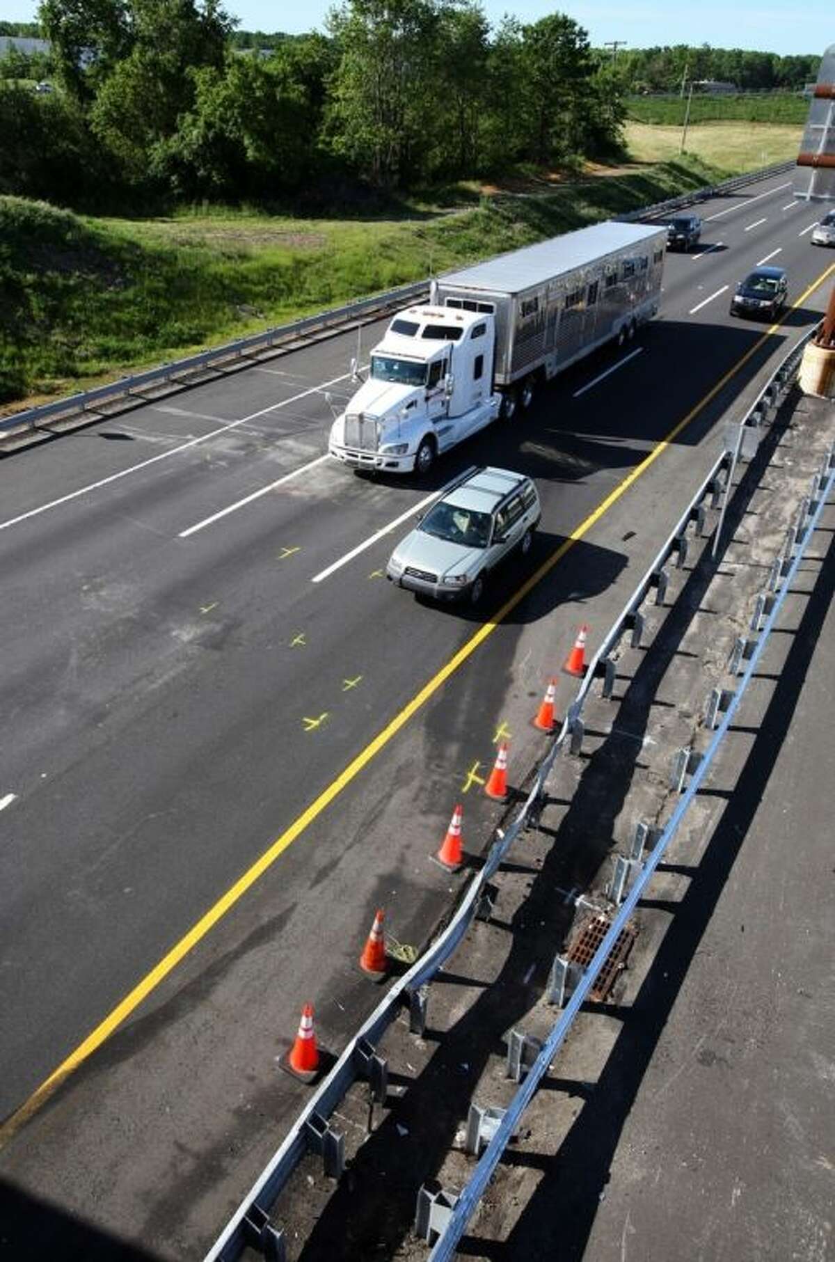 Traffic moves pass the scene of a serious accident at milepost 71 on the northbound lanes of New Jersey Turnpike on Saturday, June 7, 2014 near Cranbury, N.J. Comedian Tracy Morgan is in critical condition following an early morning accident on the New Jersey Turnpike. The comedian was injured in a crash involving six vehicles that left at least one person dead and several others, including Morgan, with serious injuries. (AP Photo/David Gard)