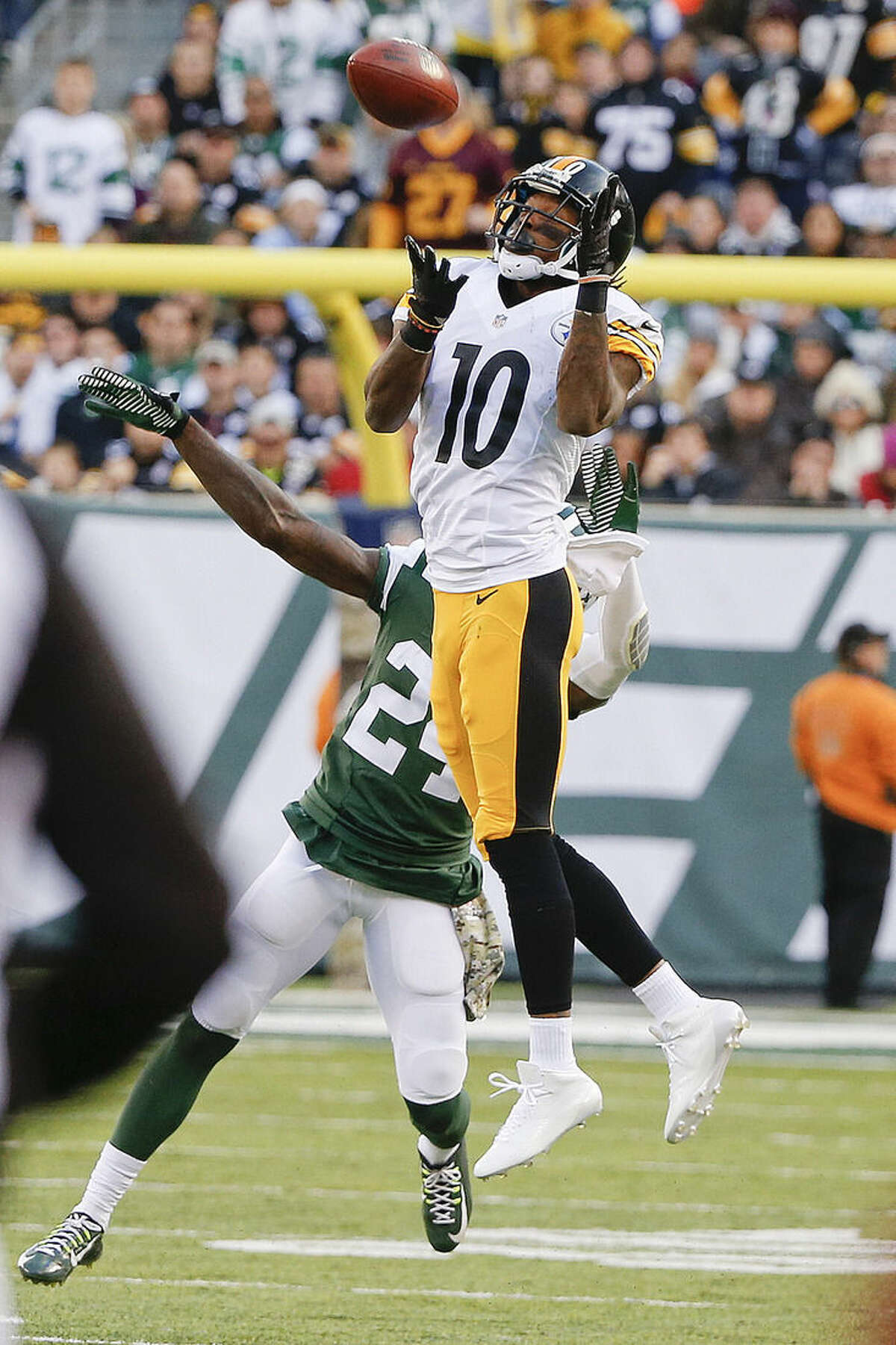 Pittsburgh Steelers wide receiver Martavis Bryant (10) catches a pass in front of New York Jets' Phillip Adams (24) during the second half of an NFL football game Sunday, Nov. 9, 2014, in East Rutherford, N.J. (AP Photo/Kathy Willens)