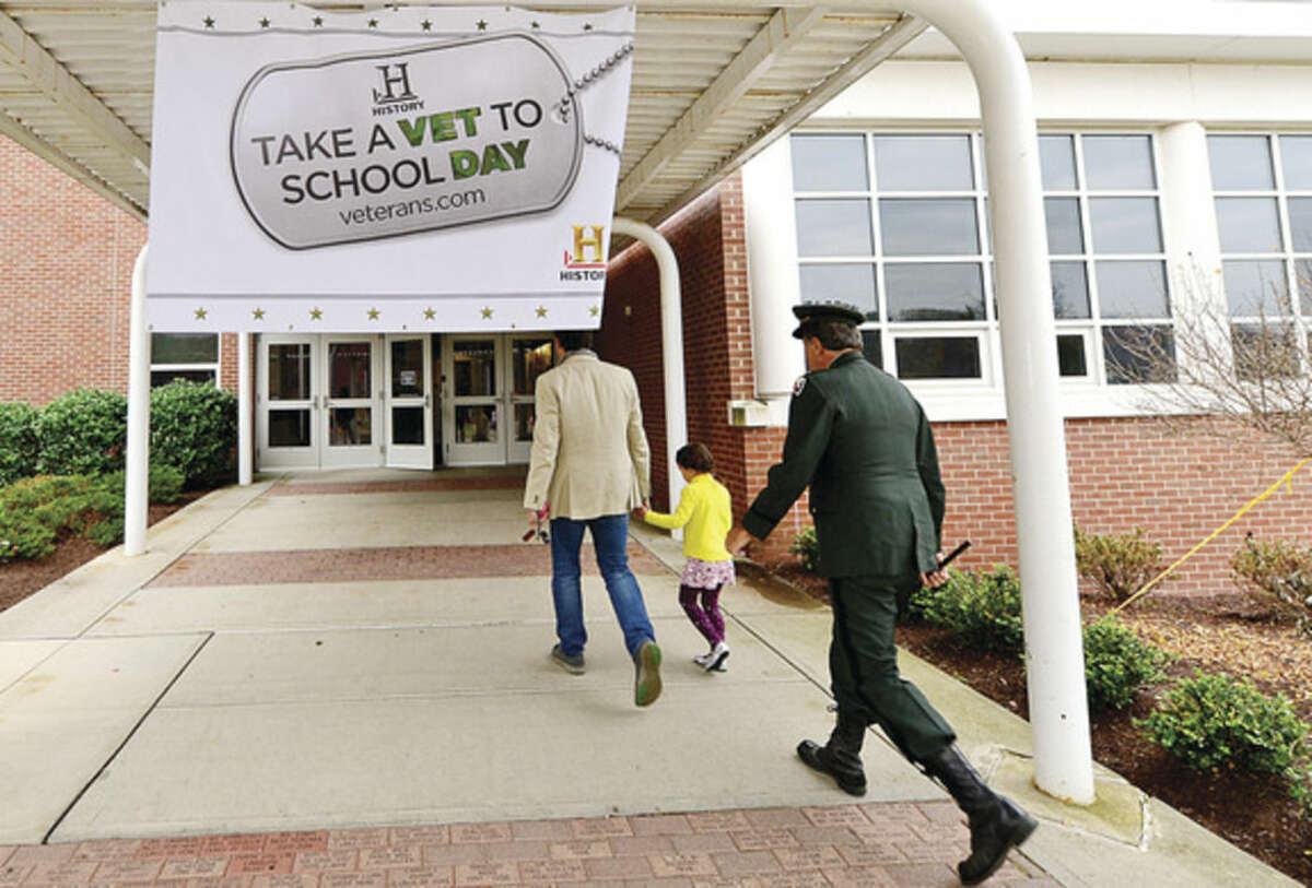 Hour photo / Erik Trautmann Cider Mill Elementary School implemented the History Channel's Take a Veteran to School Day as part of their recognition of Veteran's Day in Wilton Tuesday.