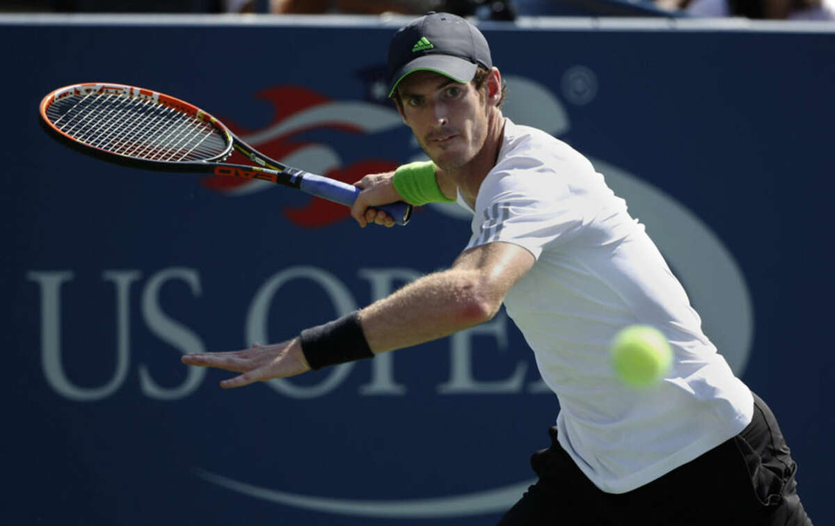 Andy Murray, of the United Kingdom, returns a shot against Robin Haase, of the Netherlands, during the opening round of the 2014 U.S. Open tennis tournament, Monday, Aug. 25, 2014, in New York. (AP Photo/Kathy Willens)