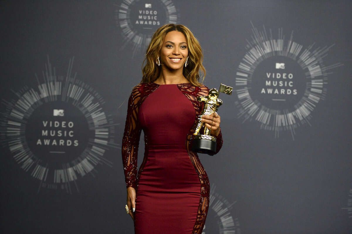 Beyonce poses with her Video Vanguard Award in the press room at the MTV Video Music Awards at The Forum on Sunday, Aug. 24, 2014, in Inglewood, Calif. (Photo by Jordan Strauss/Invision/AP)