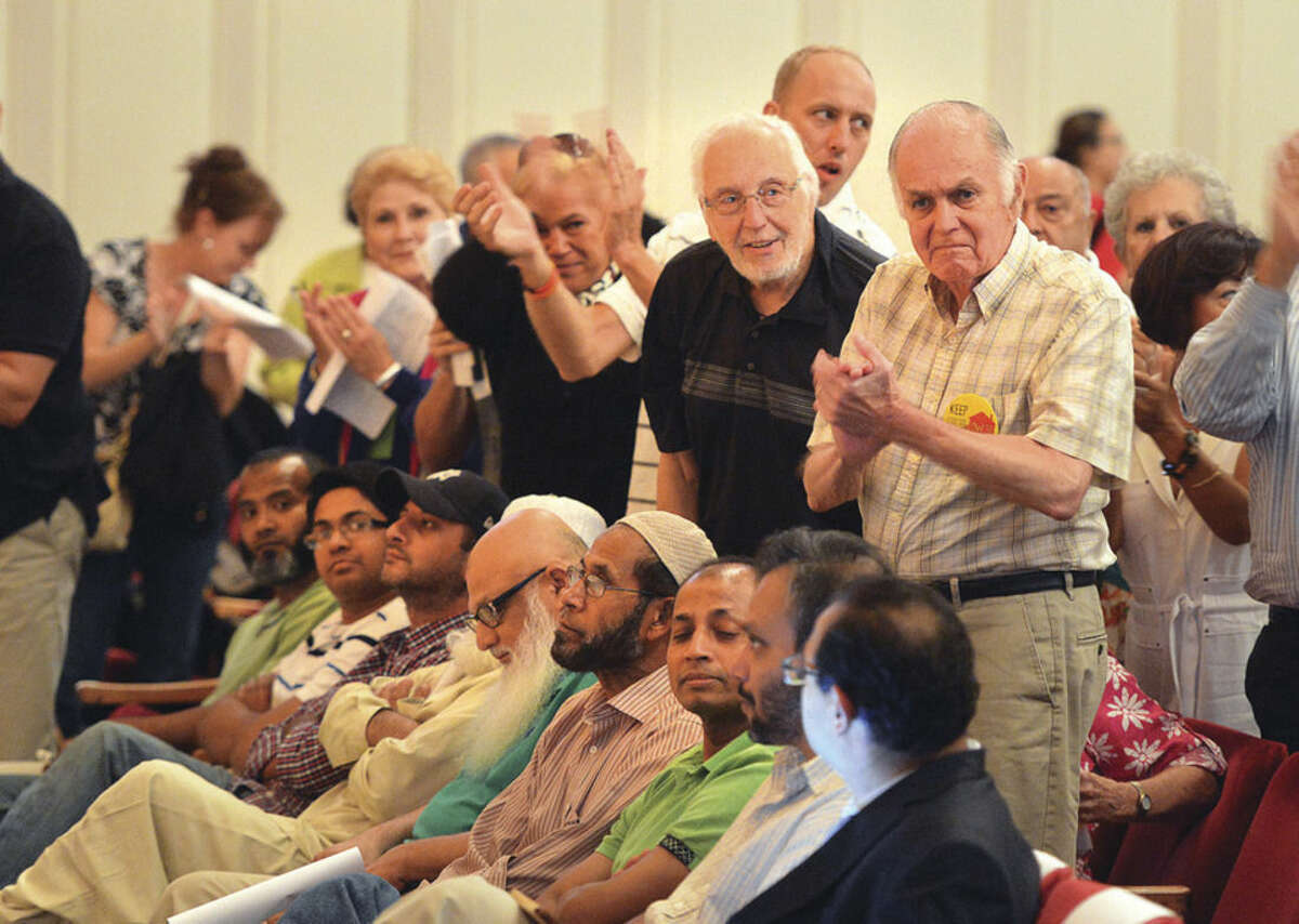 Hour photo/Alex von Kleydorff Applause for speakers during the Norwalk Zoning Commission Public Hearing regarding the proposed Al Madany Islamic Center