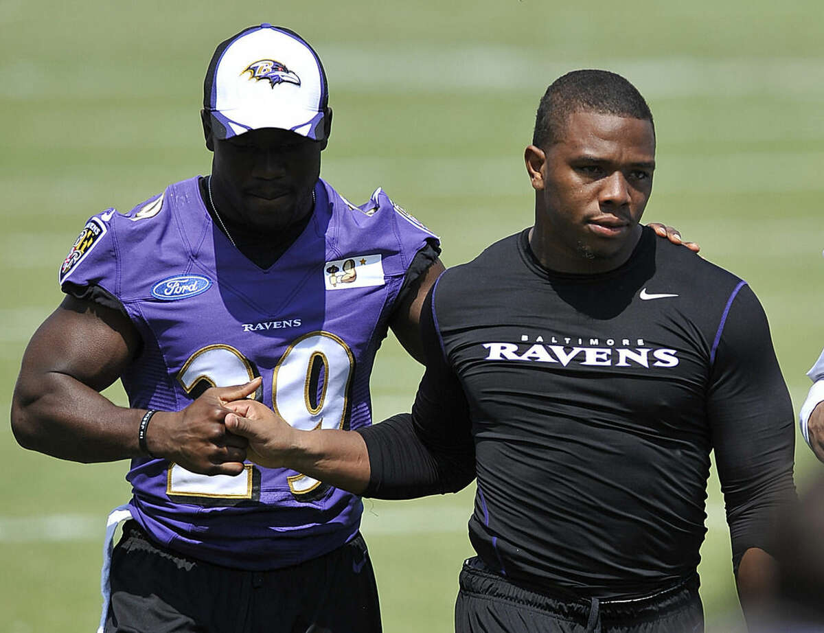 FILE - In this July 31, 2014, file photo, Baltimore Ravens running back Ray Rice, right, walks off the field with Justin Forsett before addressing the media at a news conference in Owings Mills, Md. The Ravens have cut Ray Rice. Hours after the release of a video that appears to show Rice striking his then-fiancee in February, the team terminated his contract Monday, Sept. 8, 2014. (AP Photo/Gail Burton, File)