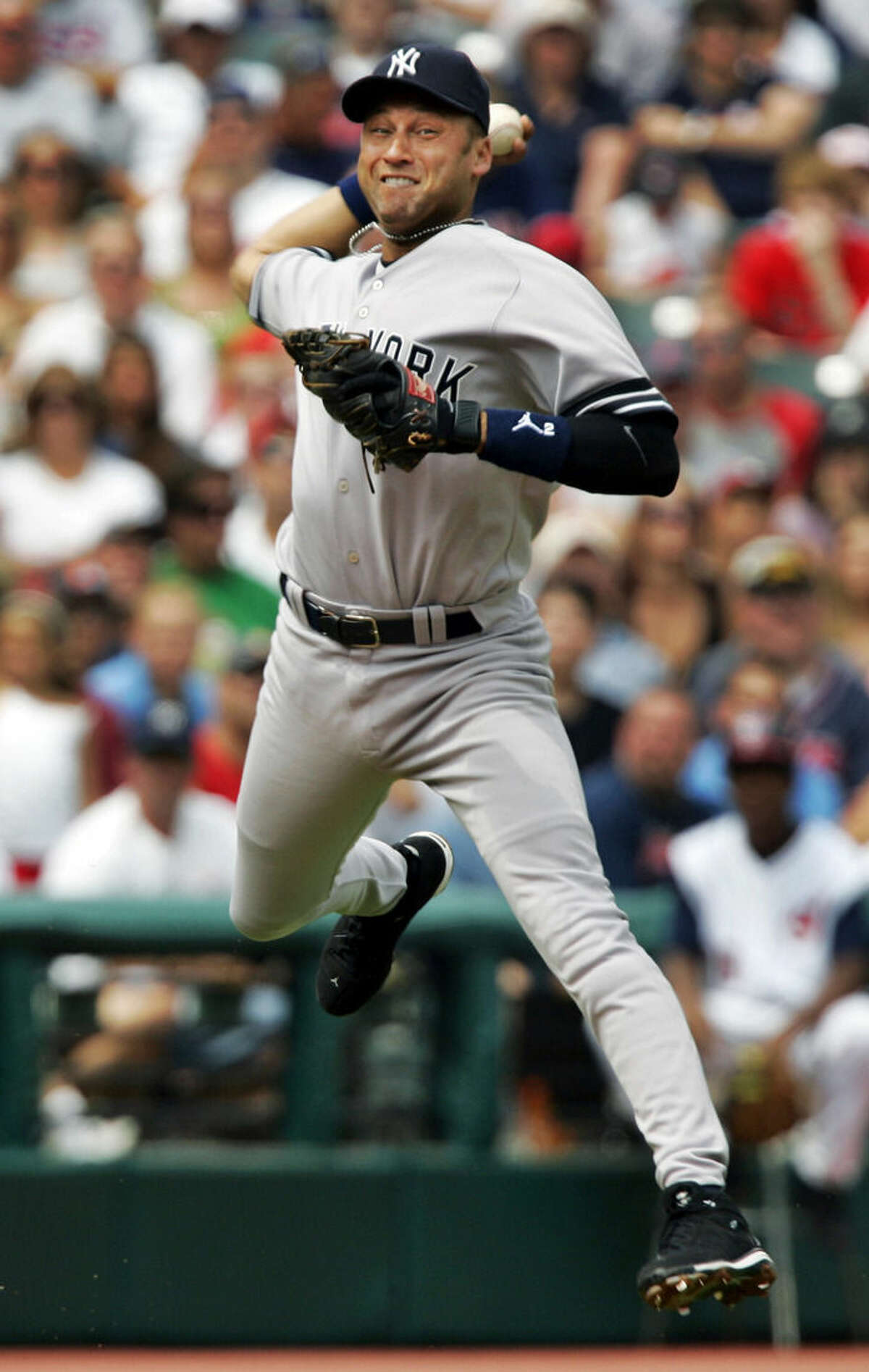 FILE - In this Aug. 12, 2007, file photo, New York Yankees shortstop Derek Jeter makes a leaping throw to get Cleveland Indians' Casey Blake at first base in the first inning of a baseball game in Cleveland. A five-time World Series champion and sixth on the career hits list, Jeter, now 40, is set to retire after this season after spending two decades as the shortstop for the Yankees. (AP Photo/Mark Duncan, File)