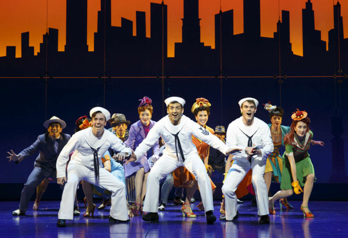 FILE - In this undated file image released by Matt Ross Public Relations, Clyde Alves, front row from left, Tony Yazbeck and Jay Armstrong Johnson appear during a performance of "On the Town," in New York. More than two dozen cast members from the Broadway revival of "On the Town" will be appearing on the Macy's Thanksgiving Day Parade route, adding a little razzle-dazzle amid the Snoopy and Buzz Lightyear balloons. In addition to "On the Town," shows to be spotlighted Thursday include "A Gentleman's Guide to Love and Murder," Sting's "The Last Ship," "Side Show" and "Finding Neverland." (AP Photo/Matt Ross Public Relations, Joan Marcus, File)