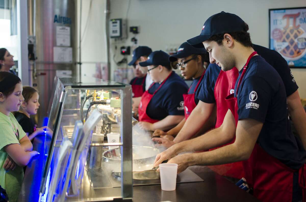 Sub Zero ice Cream will open June 17 at 15810 Southwest Fwy. in Sugar Land. The ice cream is made to order using liquid nitrogen. Shown: Workers preparing ice cream for customers.
