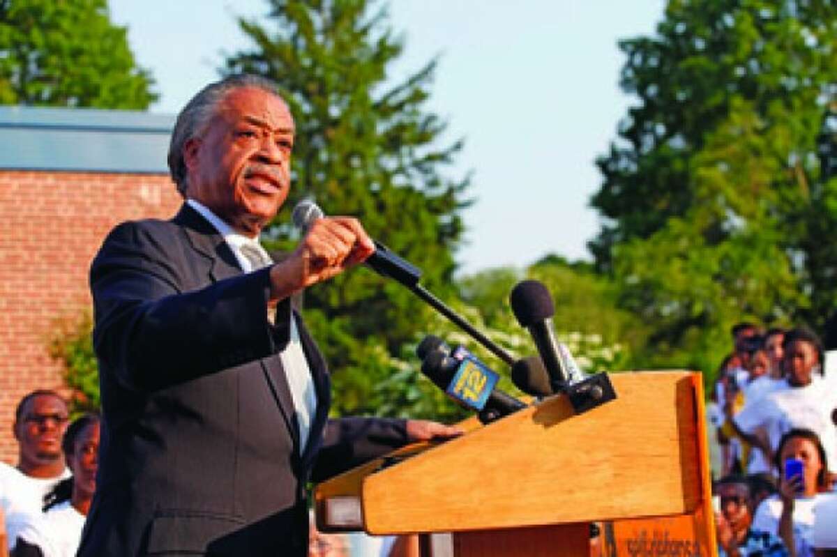 The Rev. Al Sharpton speaks at a local NAACP rally in support of equal education for all students, held at Brookside School in Norwalk Tuesday evening. Hour Photo / Danielle Robinson