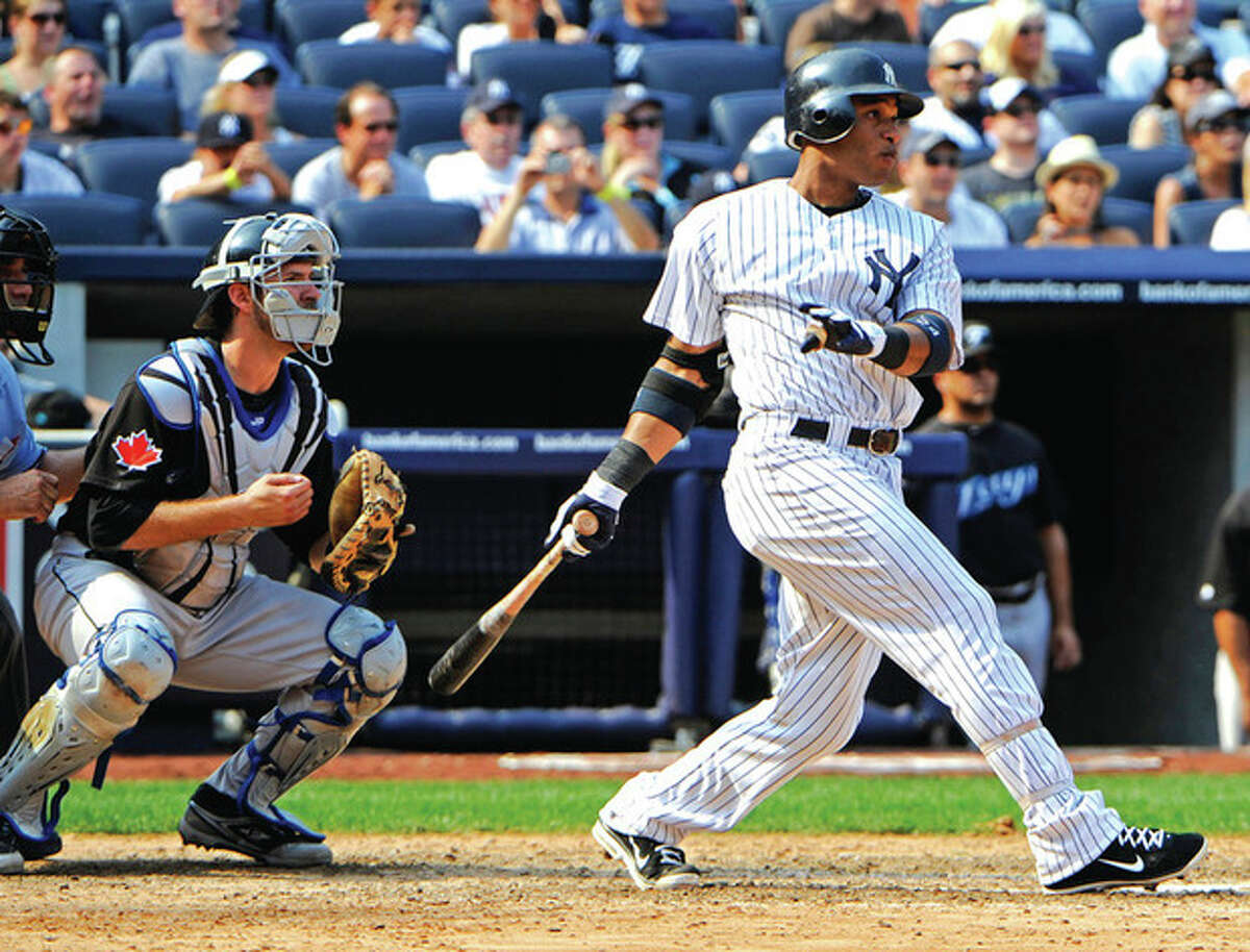 AP photo Robinson Cano of the New York Yankees follows through on his two-run double in the seventh inning Saturday afternoon against the Toronto Blue Jays. The hit lifted the Yankees to a 6-4 victory over Toronto.