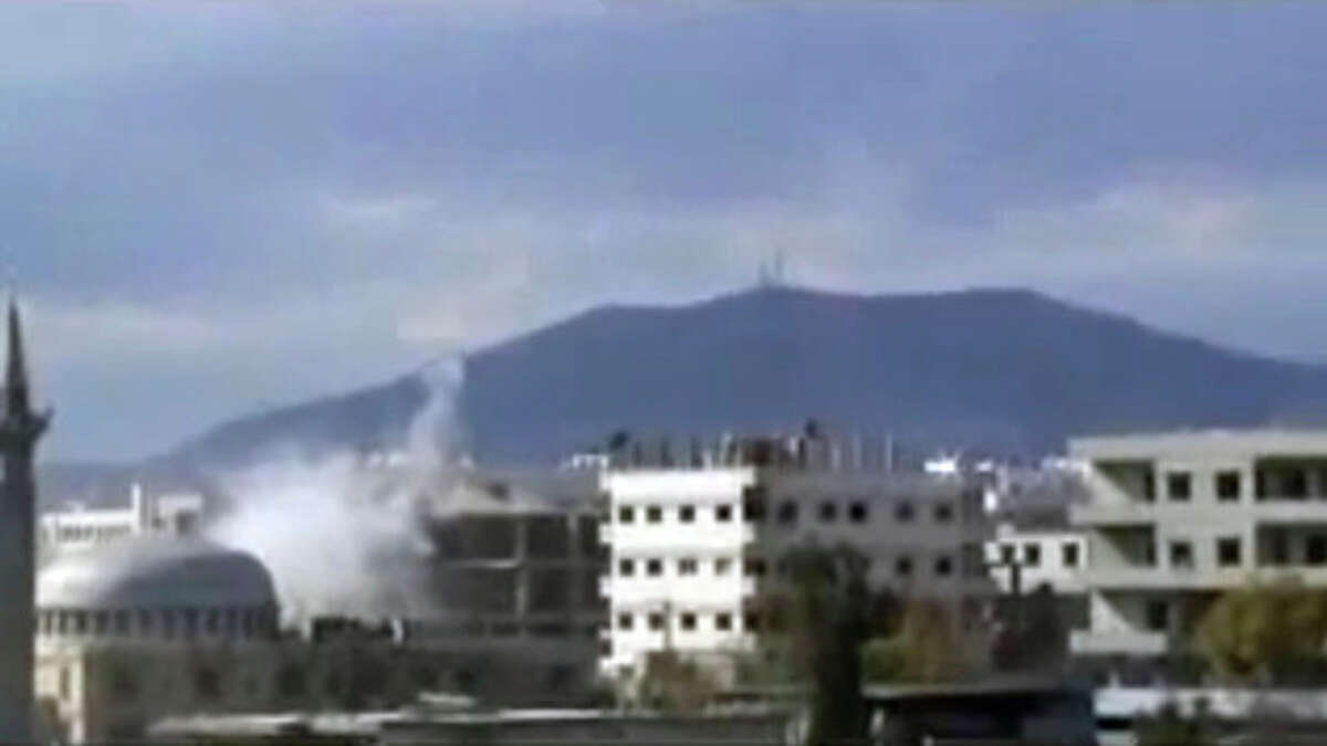 This image from amateur video made available by Shaam News Network on Monday, Feb. 6, 2012, purports to show an explosion in Damascus, Syria. Government forces shelled the central Syrian city of Homs on Monday, striking a makeshift medical clinic and residential areas and killing more than a dozen people in the third day of a new assault on the epicenter of the country's uprising, activists said. (AP Photo/Shaam News Network via APTN) THE ASSOCIATED PRESS CANNOT INDEPENDENTLY VERIFY THE CONTENT, DATE, LOCATION OR AUTHENTICITY OF THIS MATERIAL. TV OUT