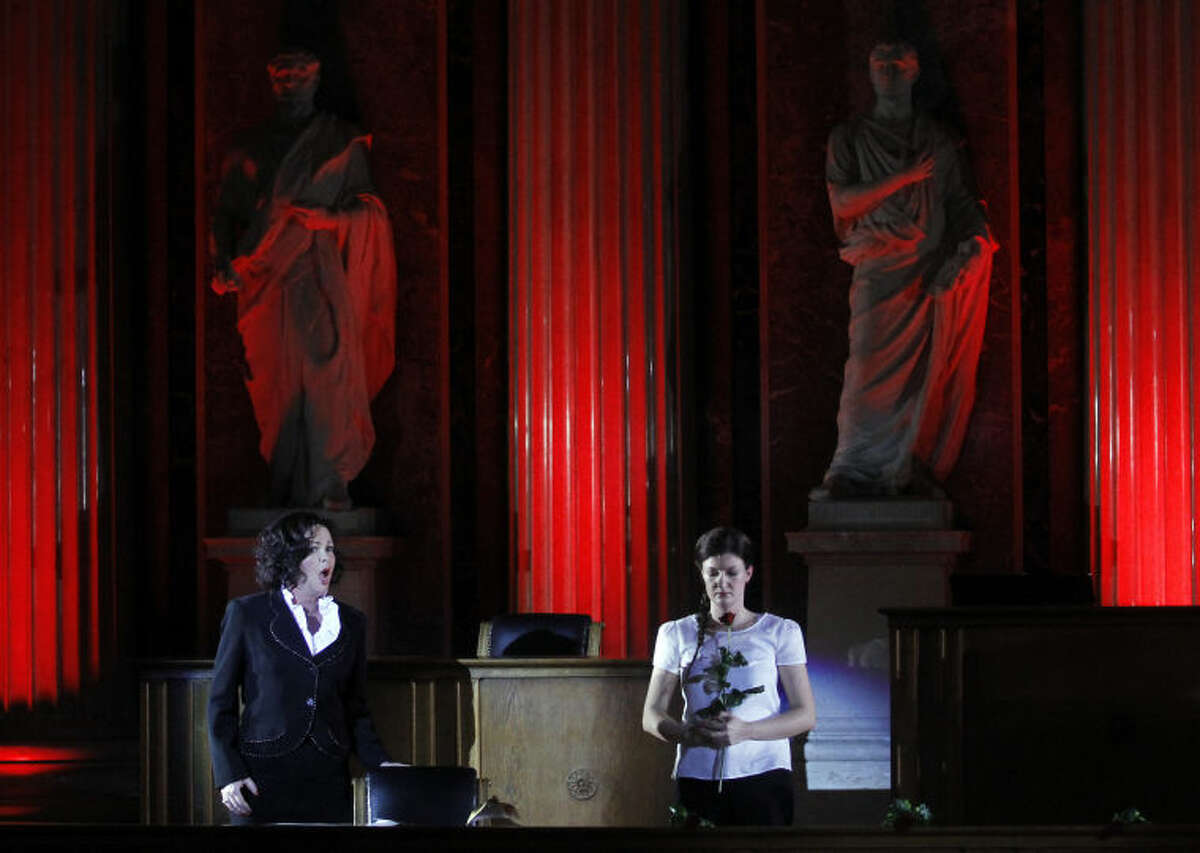TO GO WITH HOLOCAUST OPERA STORY BY GEORGE JAHN - Katerina Beranova and Silke Doerner, from left, perform during the holocaust opera 'Spiegelgrund ' by Austrian composer Peter Androsch in the imperial council hall of the Austrian parliament in Vienna, Friday, Jan. 25, 2013. Androsch goes where few others have dared, with an opera depicting how Nazis methodically killed mentally or physically deficient children. The performance premieres to mark International Holocaust Day in the parliament of Austria, a nation still atoning for its role in atrocities committed by the Nazis. (AP Photo/Ronald Zak)