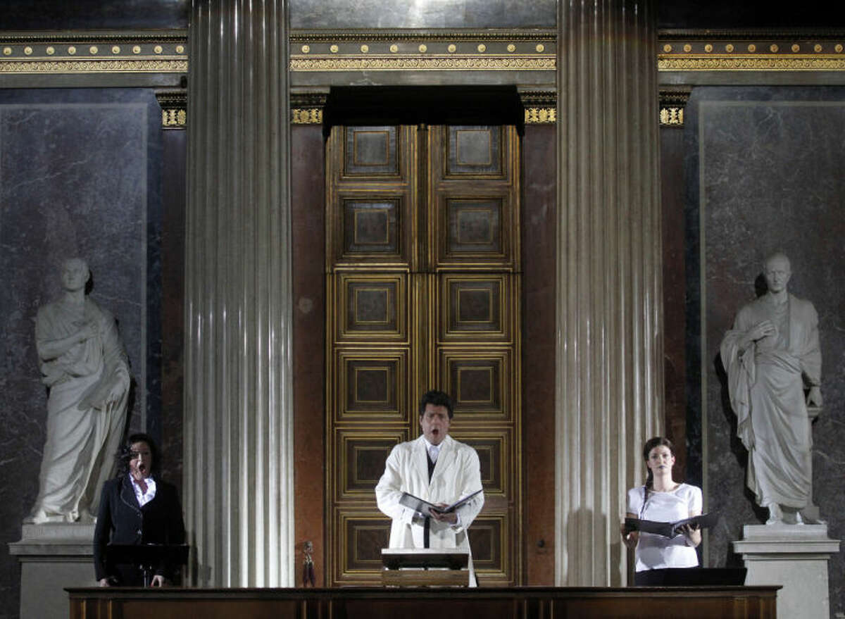 TO GO WITH HOLOCAUST OPERA STORY BY GEORGE JAHN - Katerina Beranova, Robert Holzer and Silke Doerner, from left, perform during the opera 'Spiegelgrund ' by Austrian composer Peter Androsch in the imperial council hall of the Austrian parliament in Vienna, Friday, Jan. 25, 2013. Androsch goes where few others have dared, with an opera depicting how Nazis methodically killed mentally or physically deficient children. The performance premieres to mark International Holocaust Day in the parliament of Austria, a nation still atoning for its role in atrocities committed by the Nazis. (AP Photo/Ronald Zak)