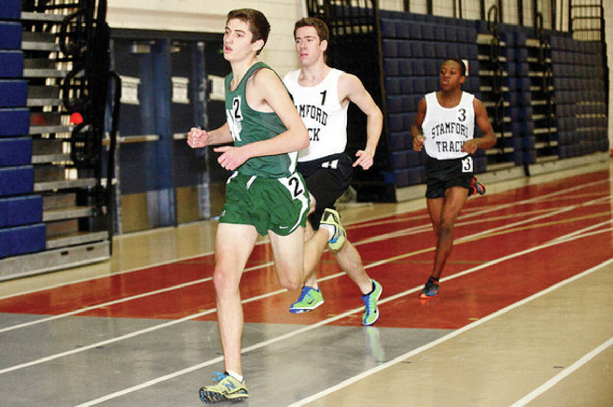 NHS' Jeremy Falcone competes in the boys 1000m during the indoor track meet in Wilton Saturday. Hour photo / Erik Trautmann