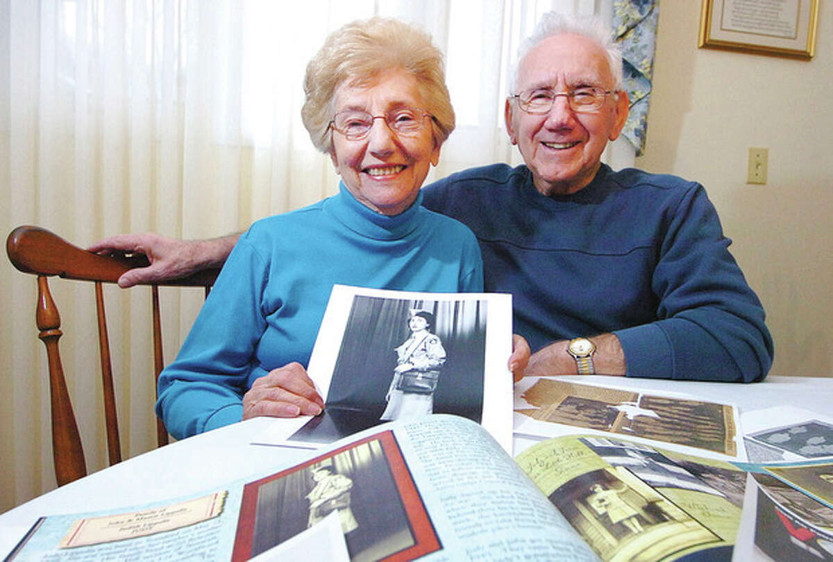 Hour Photo/ Alex von Kleydorff Judy and John Lippolis surrounded by keepsakes of her time in the Civil Air Patrol.