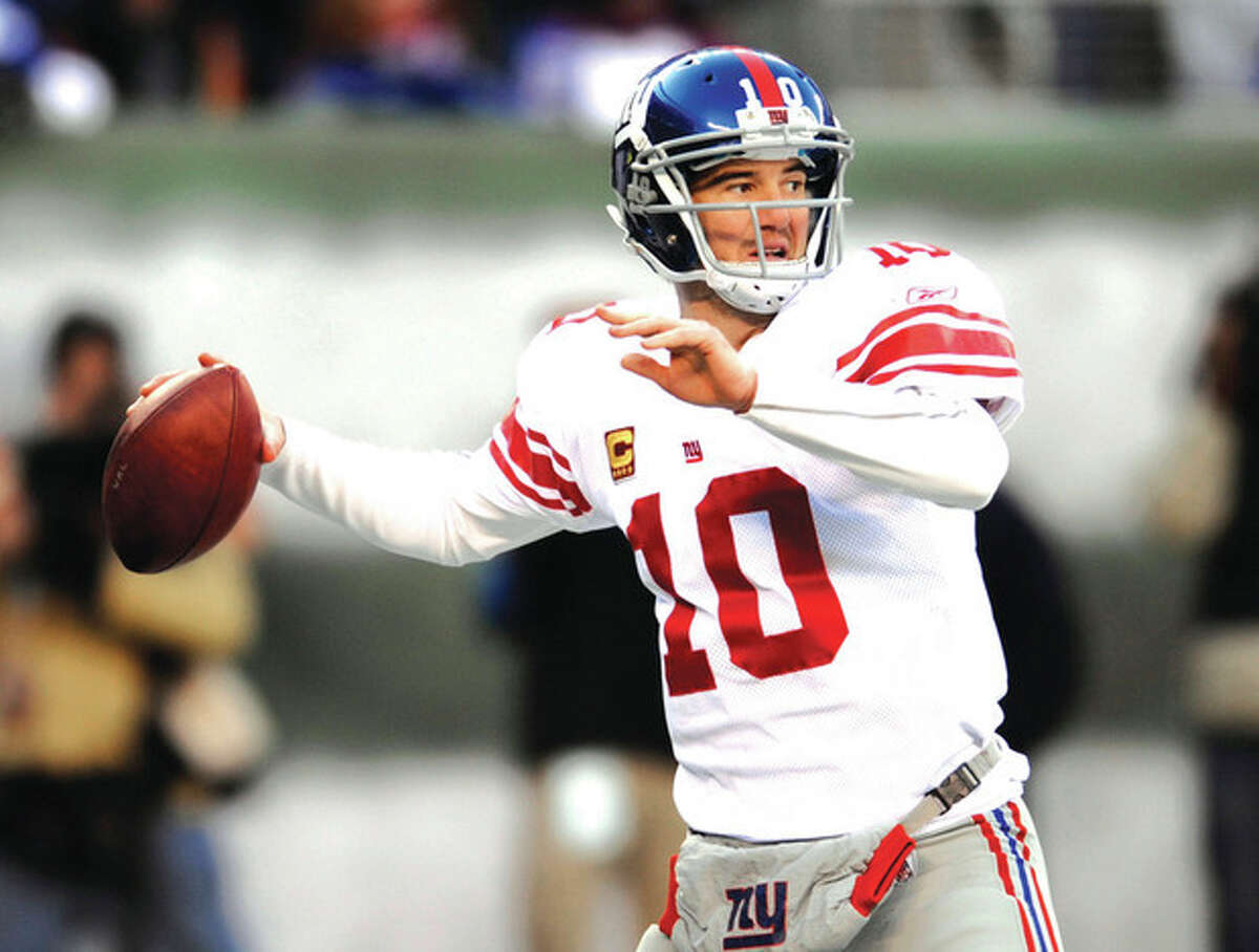 AP photo Eli Manning looks to pass during a December game. With a running game that is last in the league, the New York Giants' offense will rely on Manning's arm in their playoff game Sunday against the Atlanta Falcons.