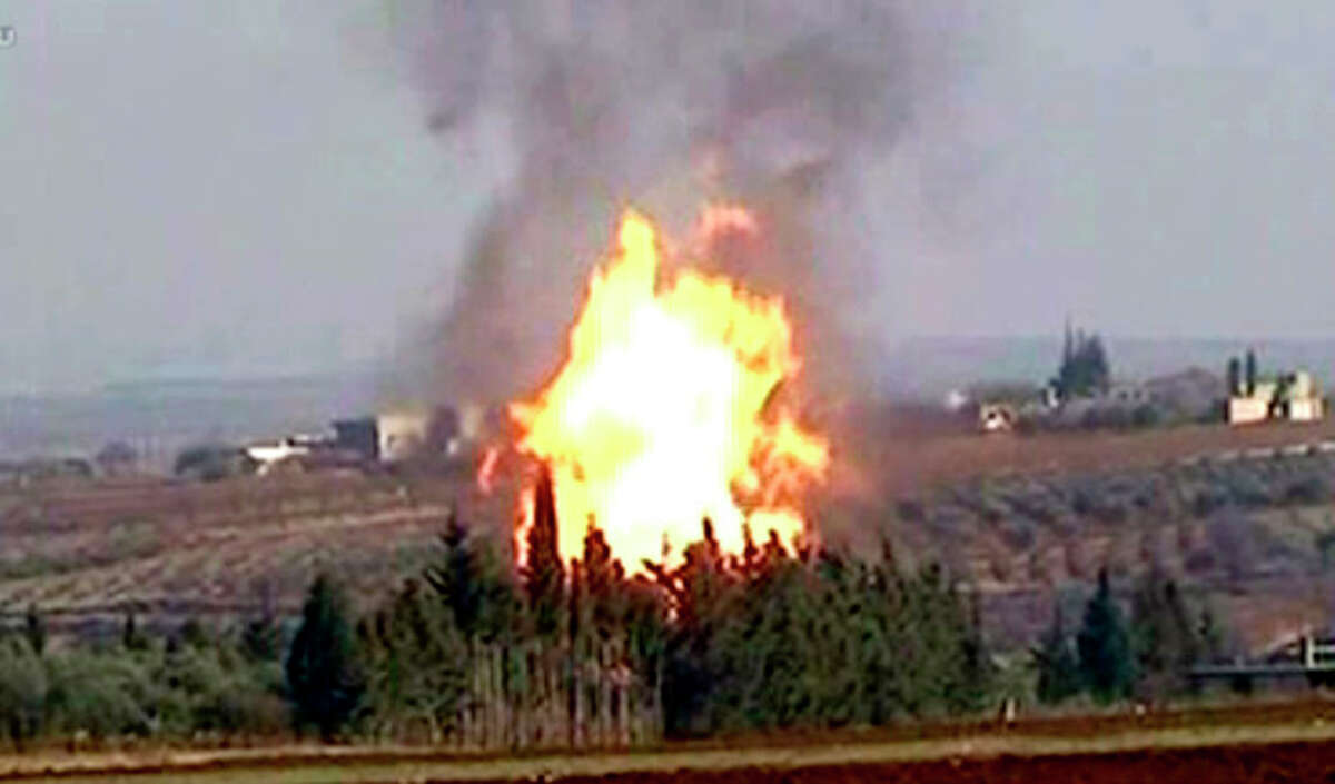 In this photo released by the Syrian official news agency SANA and according to them, flames raise from a gas pipeline caused by an explosion attack, near the town Rastan in the restive Homs province, Syria, on Tuesday Jan. 3, 2012. An explosion struck a gas pipeline in central Syria in an attack the government blamed on terrorists, the state-run news agency said. There were no casualties. The pipeline feeds two power stations. French President Nicolas Sarkozy says the Syrian regime is committing massacres and he is calling on President Bashar Assad to leave power. (AP Photo/SANA) EDITORIAL USE ONLY