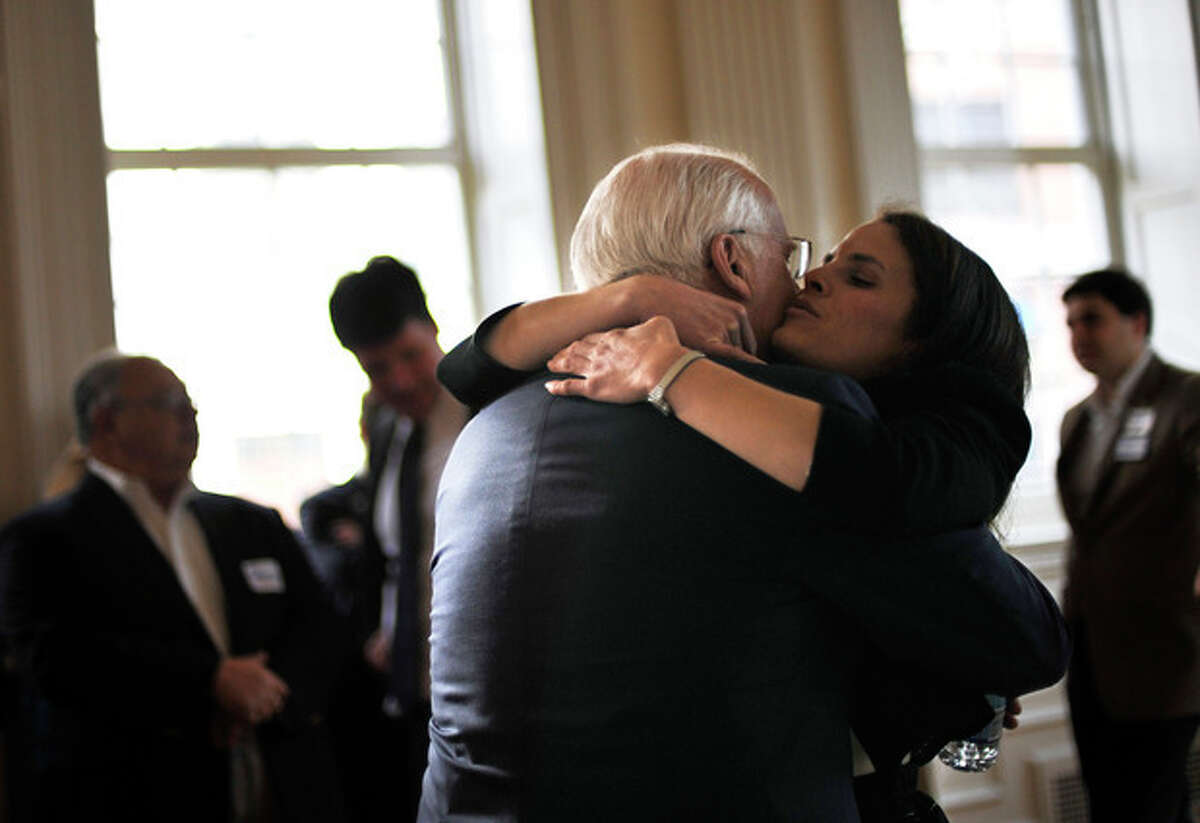 Former Connecticut U.S. Rep. Christopher Shays is hugged by his daughter Jeramy after formally announcing he is running as a Republican candidate for U.S. Senate at the Old State House in Hartford, Conn., Wednesday, Jan. 25, 2012. Shays joins four others seeking the GOP nomination. (AP Photo/Jessica Hill)