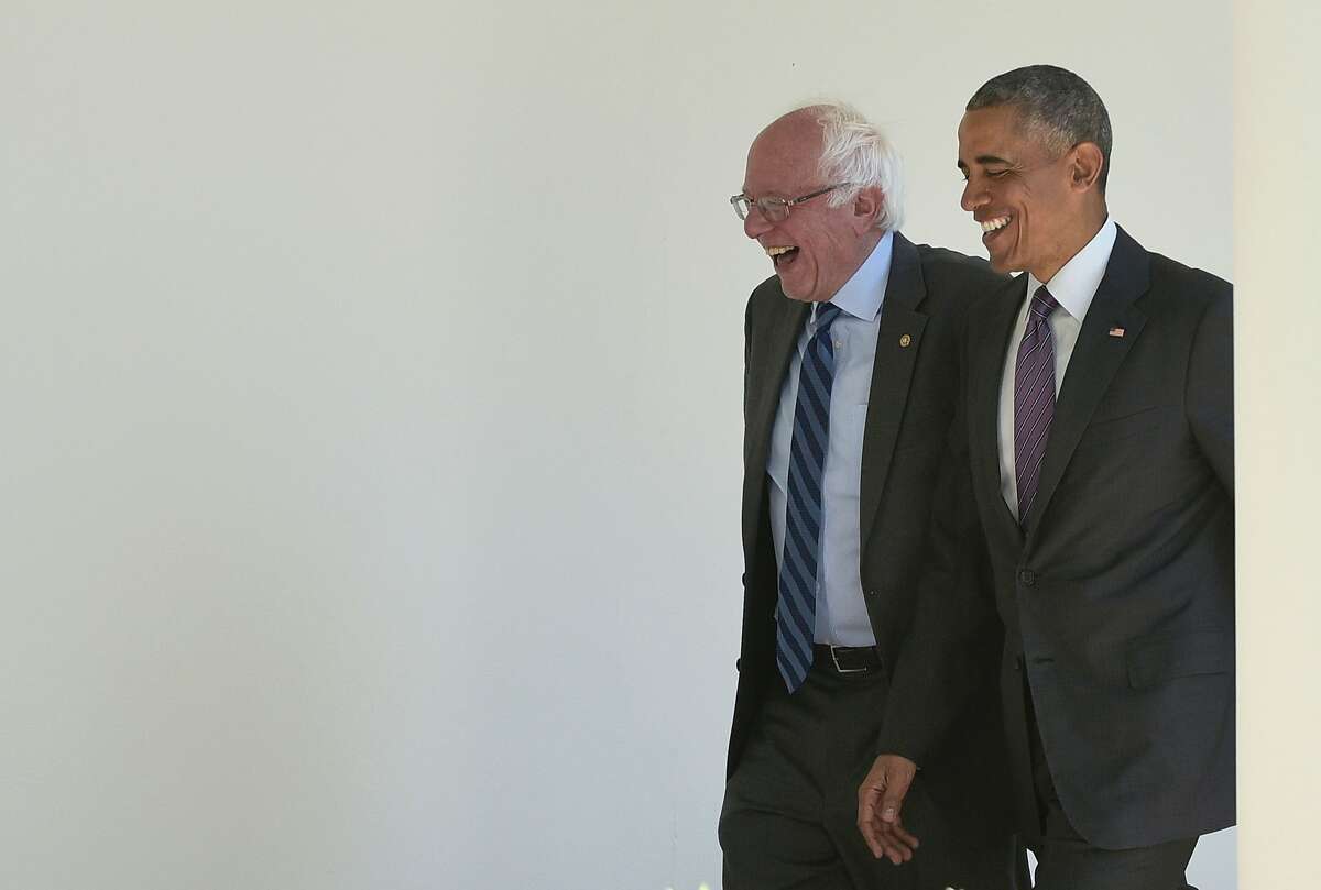 TOPSHOT - US President Barack Obama (R) walks with Democratic presidential candidate Bernie Sanders through the Colonnade for a meeting in the Oval Office on June 9, 2016 at the White House in Washington, DC. / AFP PHOTO / MANDEL NGANMANDEL NGAN/AFP/Getty Images