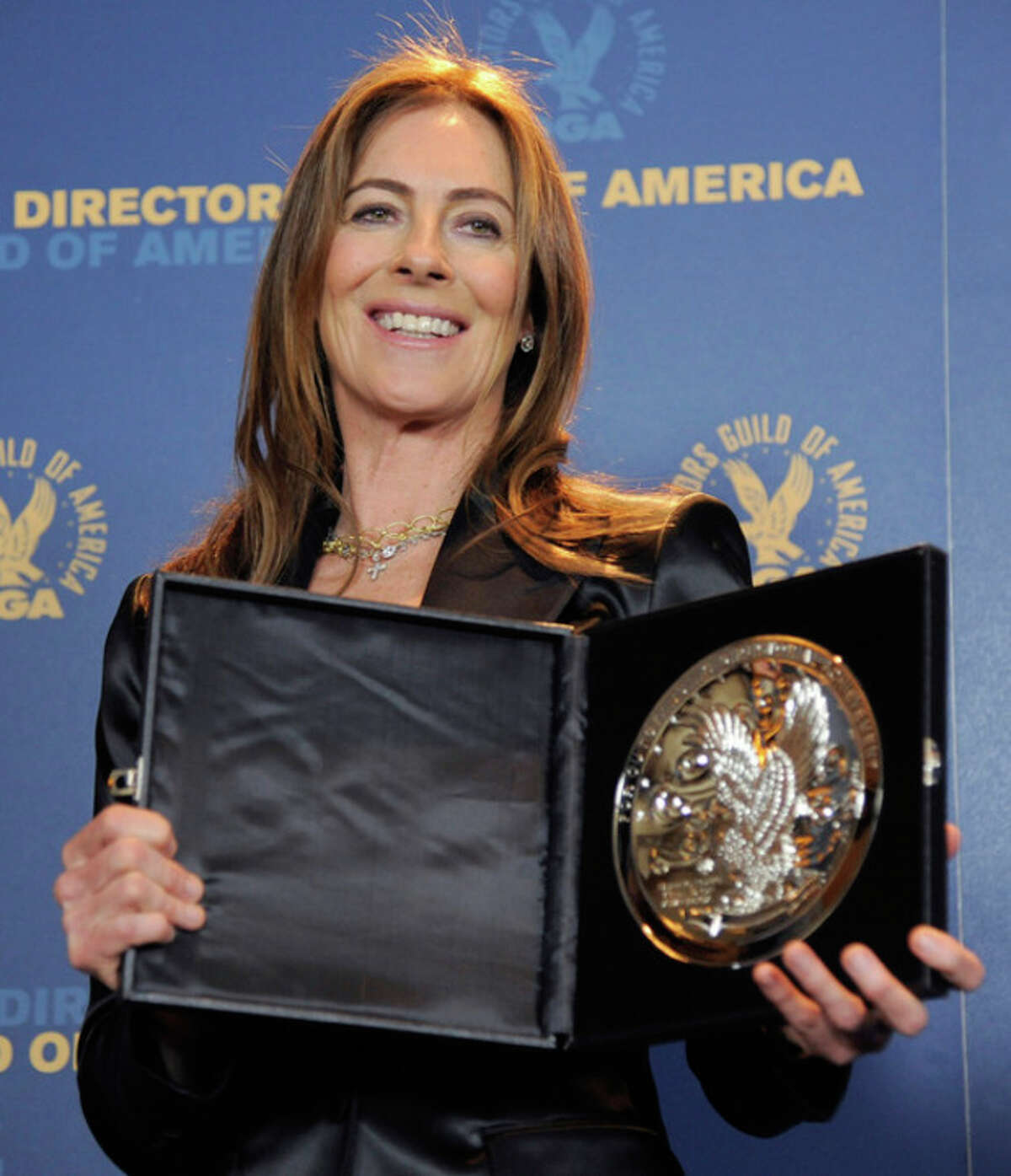 Kathryn Bigelow poses backstage with her feature film nomination plaque for "Zero Dark Thirty" at the 65th Annual Directors Guild of America Awards at the Ray Dolby Ballroom on Saturday, Feb. 2, 2013, in Los Angeles. (Photo by Chris Pizzello/Invision/AP)