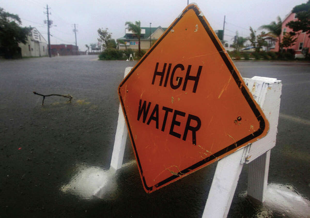 Water rises on a street in Ocean City, Md., Saturday, Aug. 27, 2011, as Hurricane Irene heads toward the Maryland coast. Hurricane Irene knocked out power and piers in North Carolina, clobbered Virginia with wind and churned up the coast Saturday to confront cities more accustomed to snowstorms than tropical storms. (AP Photo/Patrick Semansky)
