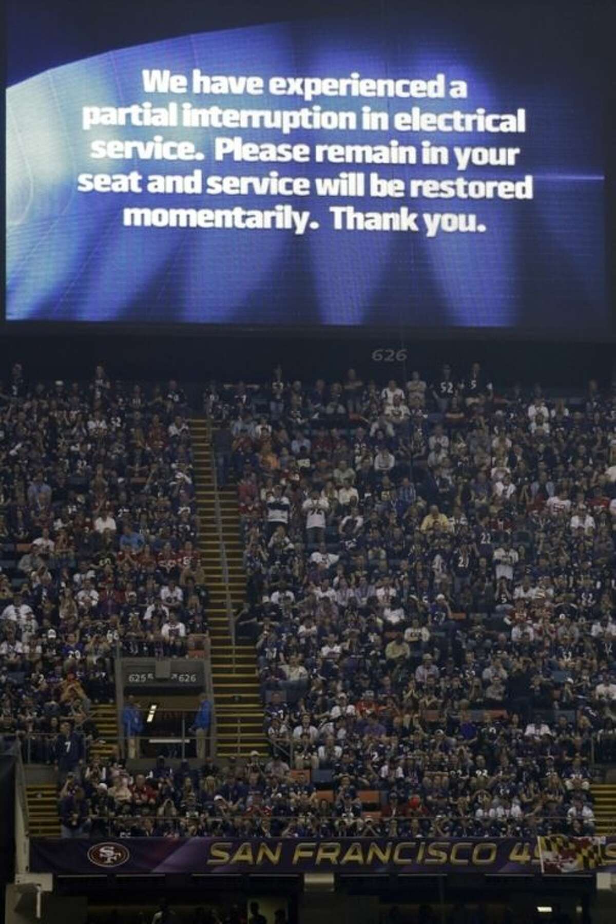 A power failure advisory appears on a screen at the Superdome during the second half of the NFL Super Bowl XLVII football game between the San Francisco 49ers and the Baltimore Ravens, Sunday, Feb. 3, 2013, in New Orleans. The power failure delayed the game by more than 30 minutes. (AP Photo/Marcio Sanchez)